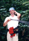 mike_w_blowgun_in_yuturi_jungle.JPG (47506 bytes)